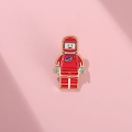 przypinka lego kosmonauta różowe tło emaliowana