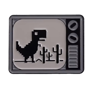 Metalowa przypinka telewizor dinozaur