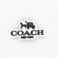 przypinka do crocsów Coach New York logo z bryczką