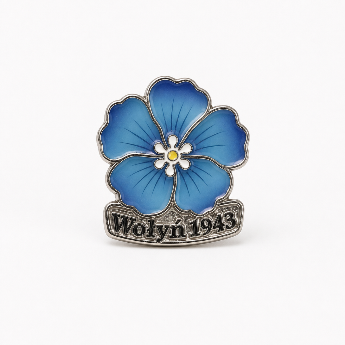 Przypinka Wołyń 1943 z niebieskim kwiatem – widok z przodu