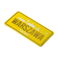 Magnes tabliczka Warszawa - widok pod kątem, żółta tablica z grafiką miasta