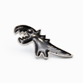 przypinka dinozaur czarny metal emalia widok z boku